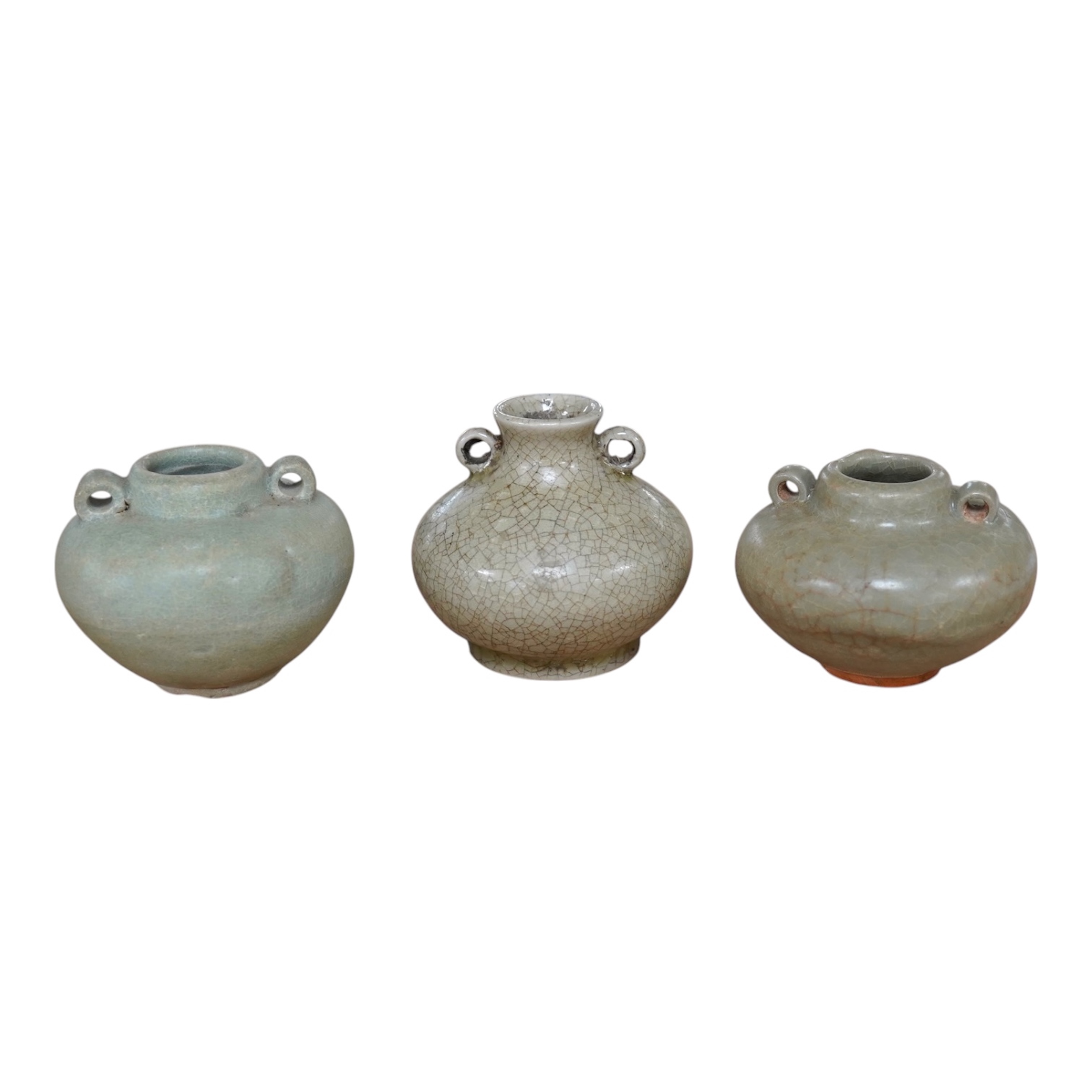 Two Chinese celadon jarlets, Yuan dynasty and a crackle glaze jarlet, tallest 6cm. Condition - good